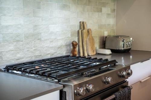 a stove top oven sitting on a counter in a kitchen at La totale : luxury 3 BR at the mountain in Mont-Tremblant