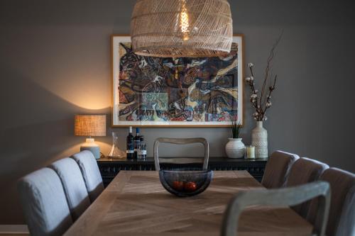 a dining room table with a bowl on top of it at La totale : luxury 3 BR at the mountain in Mont-Tremblant
