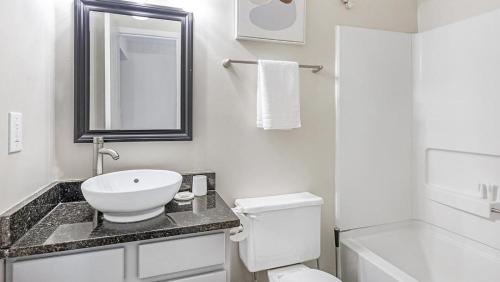 a bathroom with a sink and a toilet and a mirror at Landing - Modern Apartment with Amazing Amenities (ID3447X43) in Lewis Center