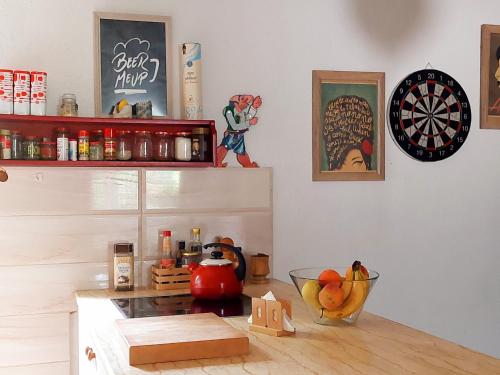 a room with a table with a dartboard on the wall at Impeccable apartment with view in Dolna Matka in Skopje