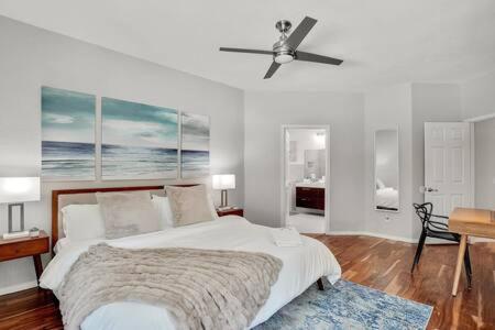 a bedroom with a bed and a ceiling fan at Luxury Escape Home with pool spa game room in Flower Mound