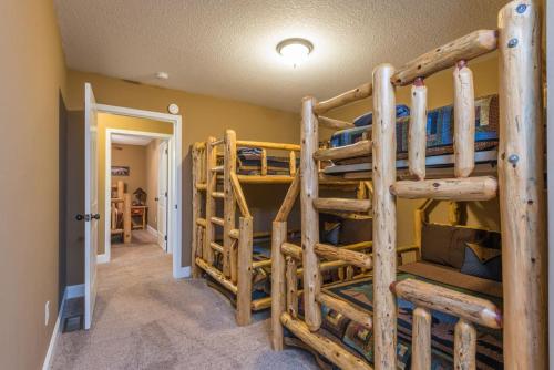 a room with two bunk beds in a house at Almost Bearadise Brand New 5 Bedroom Home with Views in Black Mountain