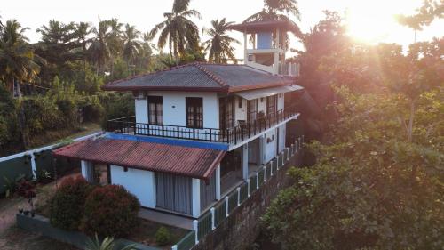 an aerial view of a house in the forest at Mango Shade in Dickwella