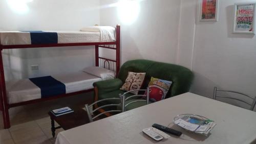 a living room with two bunk beds and a table at Aires de Montaña in Malargüe