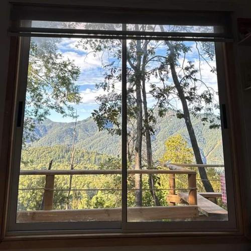 a window with a view of a mountain view at Cabañas el Mirador in Recinto