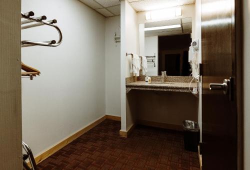 a bathroom with a sink and a mirror at Taos Valley Lodge in Taos