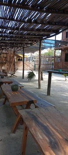 a wooden picnic table with a bowl on top of it at El Regalo El Cuyo in El Cuyo