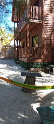 a house with a yellow hose in front of it at El Regalo El Cuyo in El Cuyo