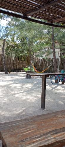a park bench with a rope tied to it at El Regalo El Cuyo in El Cuyo