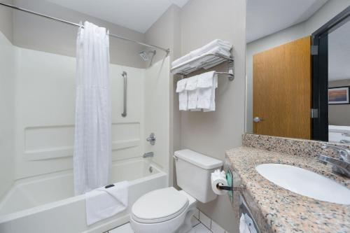 a bathroom with a white toilet and a sink at Stay 2Night Chattanooga Hamilton Place in Chattanooga