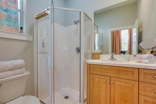 a bathroom with a shower and a toilet and a sink at Riverfront Florida Studio with Pool and Hot Tub Access in La Belle