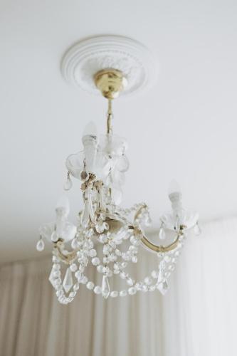 a chandelier hanging from a ceiling in a room at Penzion Jakub in Lanškroun