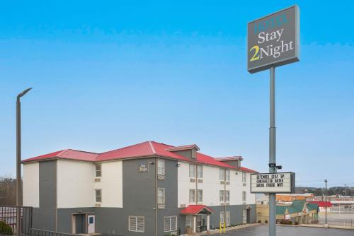 a hotel stay adjustment sign in front of a building at Stay 2Night Chattanooga Hamilton Place in Chattanooga