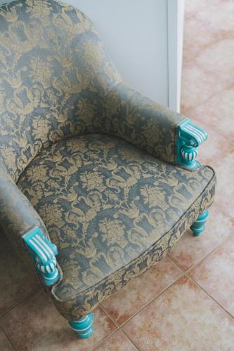 a couch sitting on the floor in a room at Penzion Jakub in Lanškroun