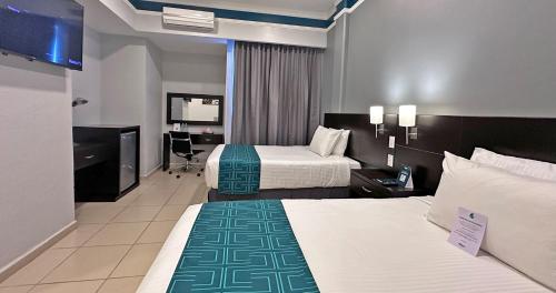 InHouse Hotel Leónにあるベッド