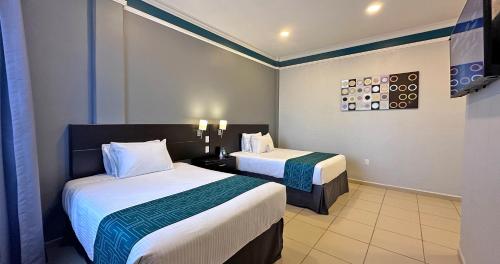InHouse Hotel Leónにあるベッド