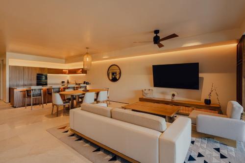 a living room with a couch and a table at Nobu Hotel Los Cabos in Cabo San Lucas