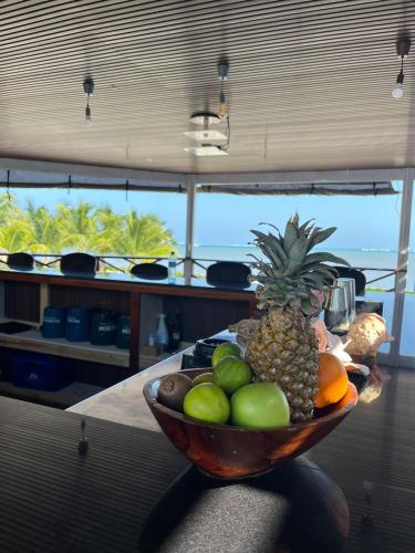 a bowl of fruit sitting on a table at Captain Morgan's Retreat in San Pedro