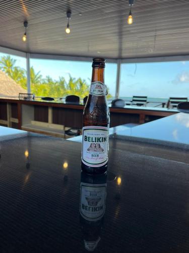 a bottle of beer sitting on top of a table at Captain Morgan's Retreat in San Pedro