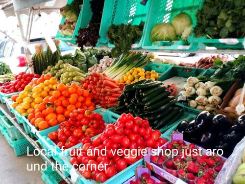 a display of fruits and vegetables at a market at "Spirit of Malta" Historic Maltese Townhouse by the sea in Sliema