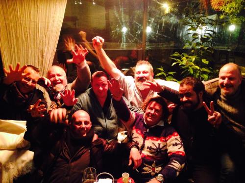 a group of people posing for a picture at La Bussola Da Gino in Quarrata