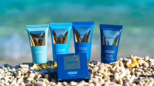 a group of four products sitting on a beach at サンメール座間味 in Zamami