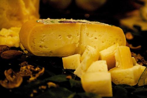 a block of cheese on a pile of leaves at La Bussola Da Gino in Quarrata