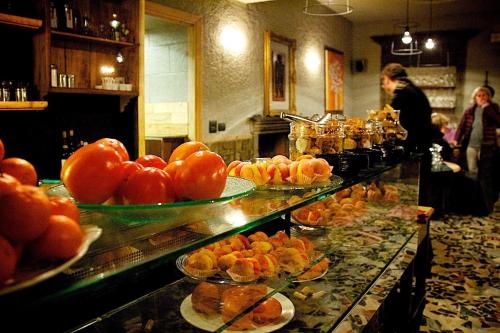 a buffet line with plates of food on display at La Bussola Da Gino in Quarrata