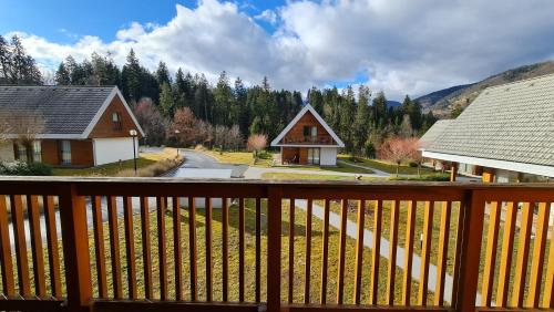a view from the deck of a home with a fence at Apartma Pikabooth in Topolšica