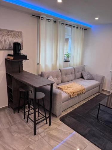 a living room with a couch and a table at Royal Stay in Olsberg