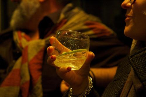a woman holding a glass with a drink at La Bussola Da Gino in Quarrata
