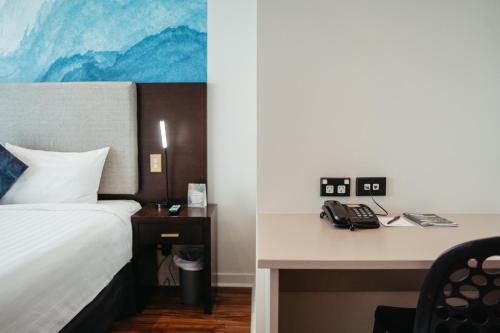 Ένα ή περισσότερα κρεβάτια σε δωμάτιο στο Auckland City Hotel - Hobson St