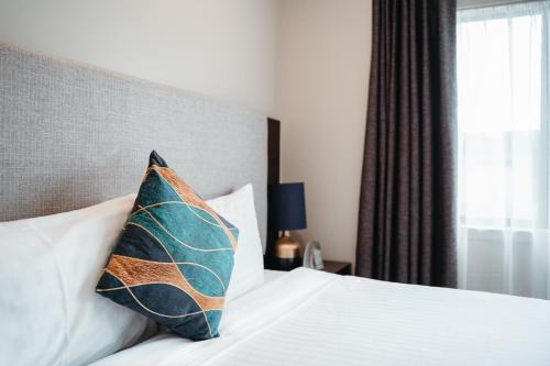 Ένα ή περισσότερα κρεβάτια σε δωμάτιο στο Auckland City Hotel - Hobson St