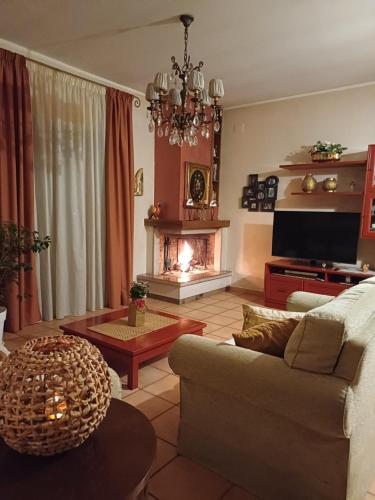 a living room with a couch and a fireplace at B&B Casa Tua in Venafro