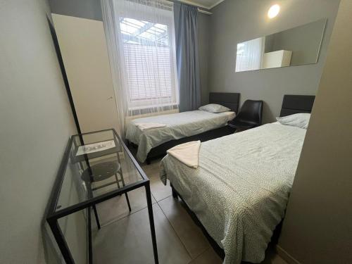 Postel nebo postele na pokoji v ubytování Grey Poznań Pokój z łazienką , Darmowy parking, Zameldowanie Bezobsługowe