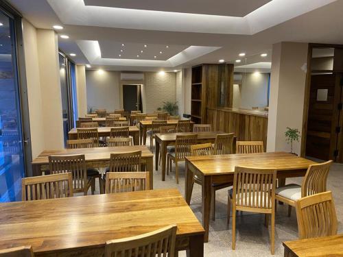 an empty restaurant with wooden tables and chairs at Tierra Mora in San Rafael