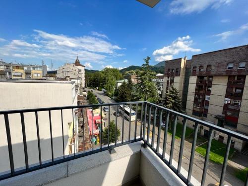 a view of a city from a balcony at LadyDi apartman in Banja Koviljača