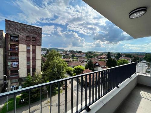 a balcony with a view of a city at LadyDi apartman in Banja Koviljača