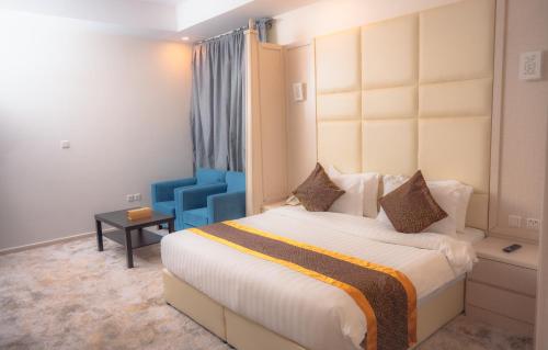 Postel nebo postele na pokoji v ubytování Areen Hotel فندق ارين