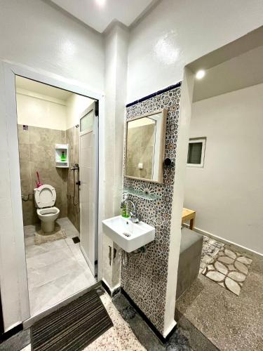 a bathroom with a sink and a toilet at Agadir House 2 in Agadir