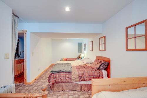 a bedroom with two beds in a room at Lakefront Tomahawk Getaway with Deck and 2 Fireplaces! in Tomahawk