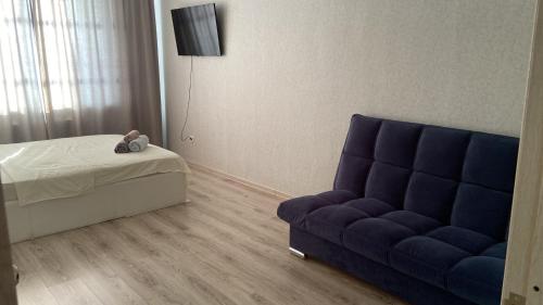 Ένα ή περισσότερα κρεβάτια σε δωμάτιο στο Комфортабельные - Уютные квартиры в Костанай (Береке)