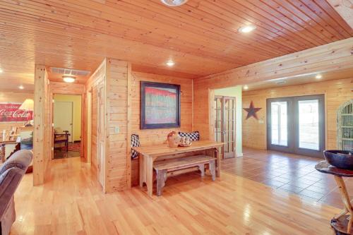 a wooden room with a wooden table in it at Spacious Cabin with Private Dock on White River! in Flippin