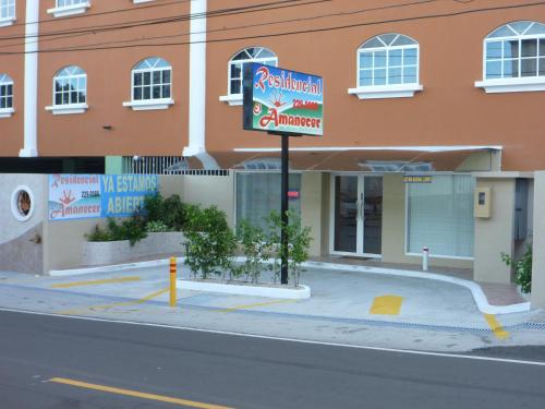 a building with a sign on the side of a street at Residencial El Amanecer in Panama City