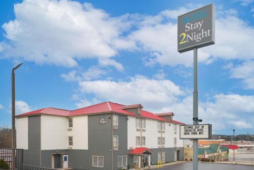 a hotel stay adjustment sign in front of a building at Stay 2Night Chattanooga Hamilton Place in Chattanooga