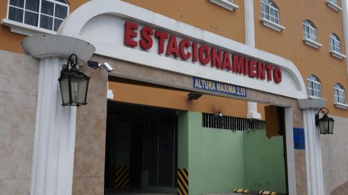a building with a sign on the front of it at Residencial El Amanecer in Panama City
