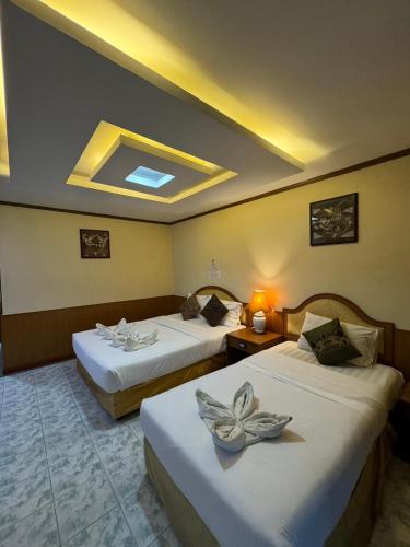 Ένα ή περισσότερα κρεβάτια σε δωμάτιο στο MrMac's Place