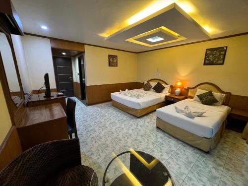 Ένα ή περισσότερα κρεβάτια σε δωμάτιο στο MrMac's Place