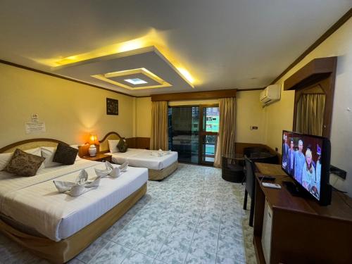 Ένα ή περισσότερα κρεβάτια σε δωμάτιο στο MrMac's Place