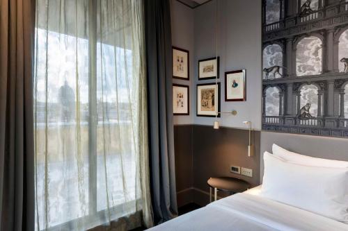 Postel nebo postele na pokoji v ubytování Radisson Collection Hotel, Roma Antica